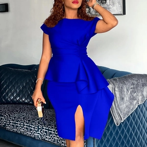 Detail of royal blue peplum midi dress with front slit and elegant ruffled waist design