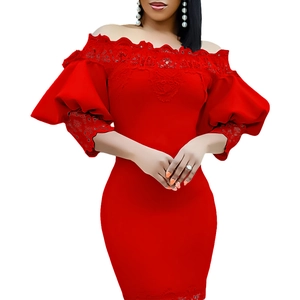 Detail of red off-shoulder dress featuring intricate lace embroidery and puff sleeves