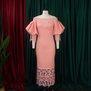 Detail of pink off-shoulder evening dress featuring delicate lace trim and puff sleeves