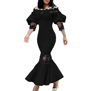 Close-up of elegant lace patchwork on black off-shoulder bubble sleeve fishtail dress