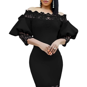 Detail of off-shoulder neckline with intricate lace trim and puffy sleeves on black dress