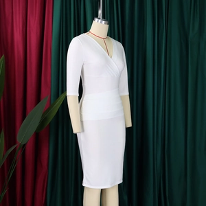 Detail of white V-neck sheath dress showing waist pleats and elegant slim fit design