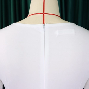 Detail of the hidden back zipper on a professional white V-neck sheath dress for women