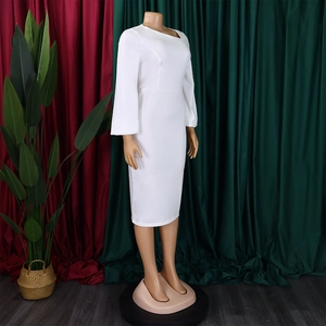 Detail of white long sleeve dress with asymmetrical neckline and slim fit pencil cut