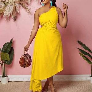 Detail of yellow one-shoulder dress featuring waist cutout and metal ring decoration