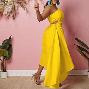 Detail of yellow one-shoulder dress featuring waist cut-out and asymmetric hemline