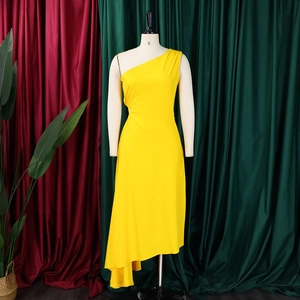 Detail of yellow one-shoulder dress with side waist ruffles and asymmetrical hem
