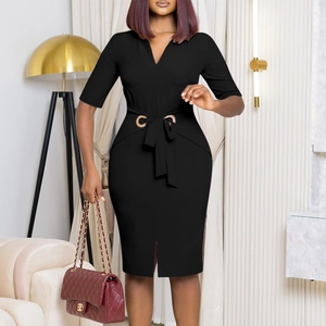 Detail of elegant black V-neck pencil dress with gold eyelets and waist tie belt