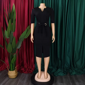 Close-up of elegant V-neckline and belted waist detail on a black bodycon pencil dress