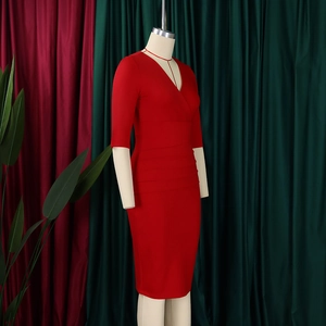 Detail of red V-neck sheath dress featuring flattering waist ruching and 3/4 sleeves