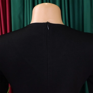 Close-up of the back neckline featuring a neat invisible zipper on a black pencil dress
