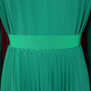 Detailed macro view of the green pleated skirt waist with wide elastic waistband