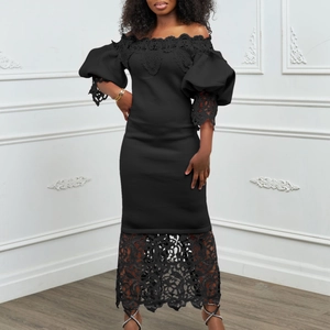 Detail of off-shoulder black dress featuring lace stitching and puff lantern sleeves