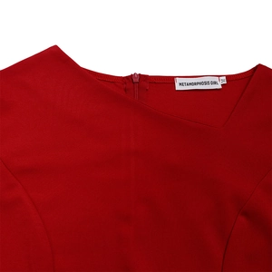 Detail view of red asymmetrical neckline dress with back invisible zipper and brand tag