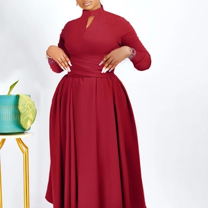 Detail of burgundy maxi dress featuring a high stand collar and crossed wrap waist design