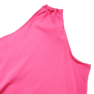 Detail of fuchsia shoulder cutout with pleated fabric and fine stitching on the dress