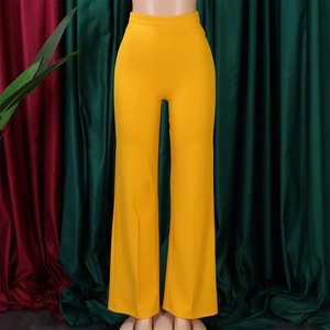 Detailed close-up of vibrant yellow high waisted wide leg trousers on a mannequin