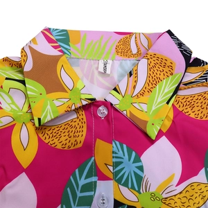 Detail shot of the tropical floral shirt collar with neat stitching and clear buttons