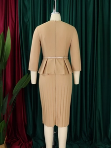 Detail of khaki V-neck dress with peplum waist and pleated skirt for office wear