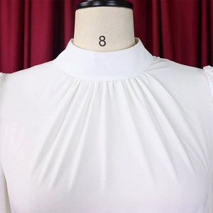 Macro detail of high collar with delicate pleats on a white chiffon top for women
