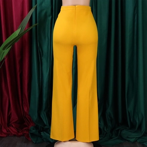 Detail view of high waist mustard yellow flare trousers with invisible back zipper closure