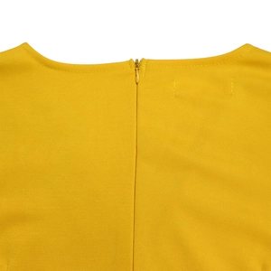 Detail of V-neck collar and high-quality invisible zipper on a bright yellow dress