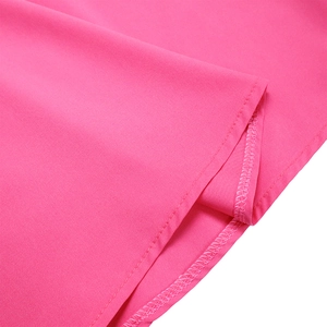 Detail of rose pink dress hem showing professional double-needle stitching and fabric texture