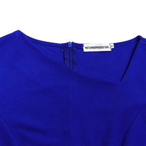 Detail of royal blue dress showing asymmetric neckline and Metamorphosis Girl brand label