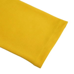 Detailed macro view of yellow knit dress cuff with precise double-needle stitching quality