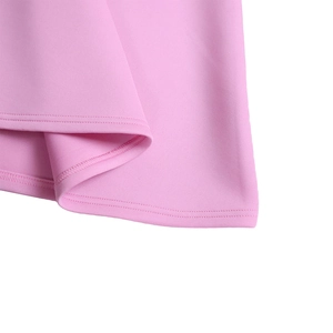 Detailed close-up of pink dress hem featuring professional double-needle stitching quality