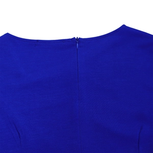 Detail of royal blue dress back with precise invisible zipper and woven fabric texture