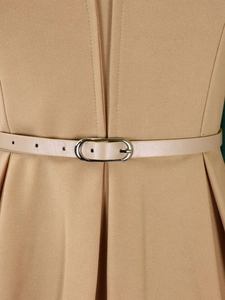 Detail of high waist pencil dress with slim beige belt and elegant metal buckle