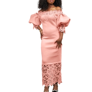 Detailed view of pink off-the-shoulder dress with lace embroidery and lantern sleeves