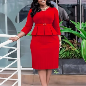 Detail of red V-neck peplum top and pleated pencil skirt with matching waist belt