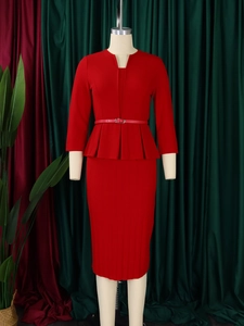 Detail of red V-neck peplum top and pencil skirt with a slim waist belt for business wear