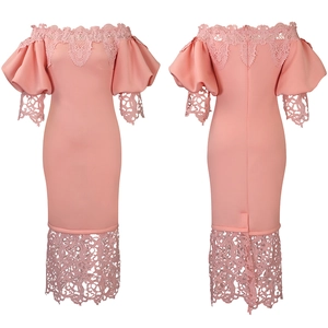 Detail of off-shoulder lace trim and lantern sleeves on a pink evening party dress
