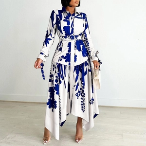 Detail of shirt collar and button-down front on blue floral high-low dress with belt