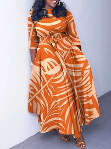 Plus size A-line dress featuring vibrant orange palm leaf prints and a waist tie belt