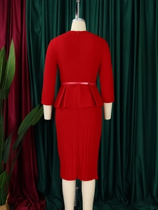 Rear view of bright red V-neck pencil dress with peplum waist and pleated midi skirt