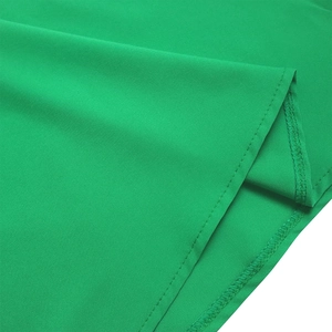 Detail shot of green chiffon dress hem showing neat stitching and fine fabric texture