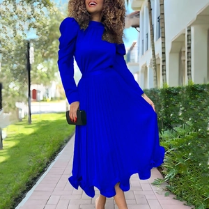 Detail of royal blue pleated long dress with puffy sleeves and high collar design