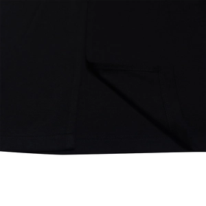 Macro shot of precise double-needle stitching on the hem of a black dress fabric