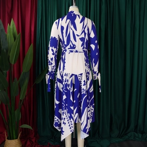 Back view of the blue floral print maxi dress featuring asymmetric hem and waist tie