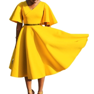 Detail of V-neck yellow dress featuring elegant ruffle sleeves and a golden slim belt