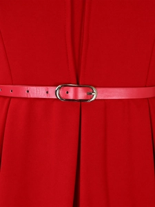 Detail of red V-neck dress with a slim red leather belt and silver oval metal buckle