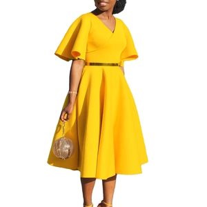 Detailed view of the yellow V-neck dress featuring elegant butterfly sleeves and a golden belt