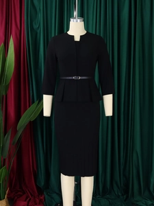 Detail of elegant black peplum waist pencil dress with V-neck and slim belt for office work