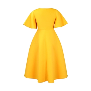 Back view of yellow mid-length dress featuring a high waist and flared A-line skirt