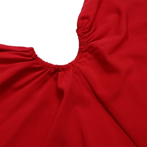 Detailed close-up of elasticated smocking and stitching on red one-shoulder dress