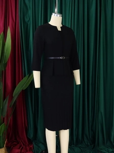 Detail of professional black two-piece skirt suit with adjustable waist belt and pencil skirt